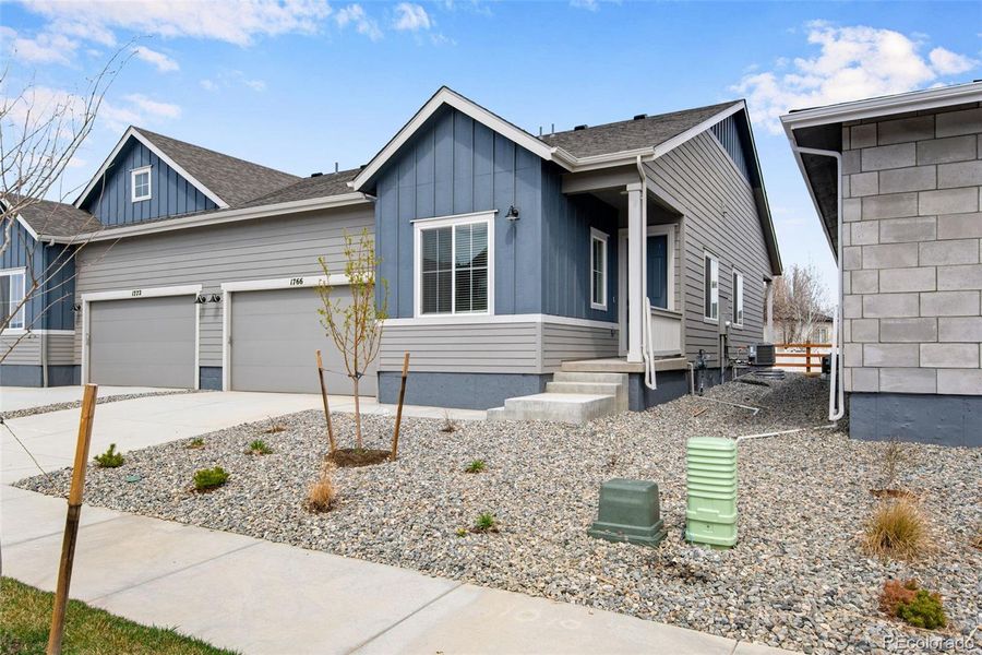 Front exterior of a new home in , Berthoud, CO, highlighting curb appeal (Image 26).