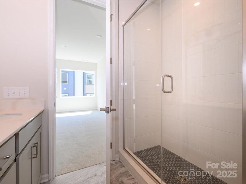 Walk-in shower with timeless yet modern tile details.