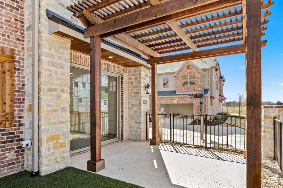 Exterior details and patio area of a home in The Tribute, The Colony (Image 4).