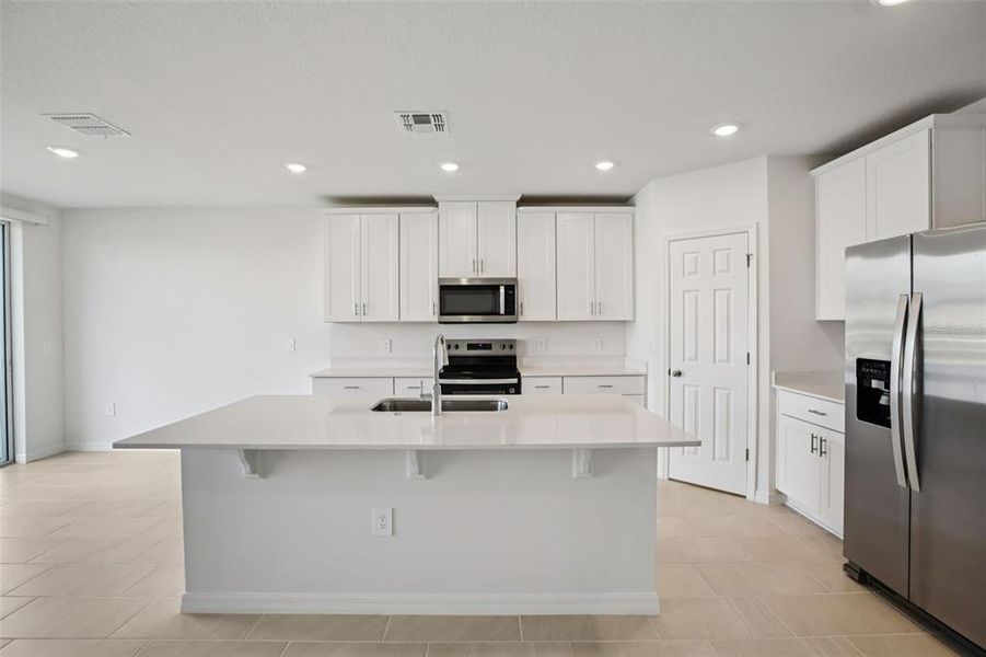 Furnished interior view inside a new home in Villamar - Signature Series, Winter Haven (Image 10).