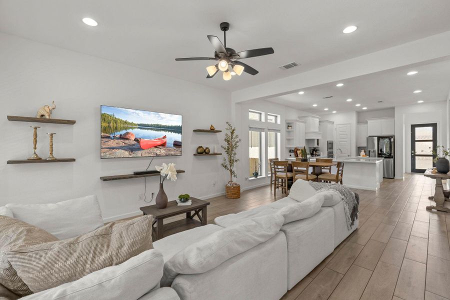 An open floorplan seamlessly connects the living space to the dining area and kitchen.