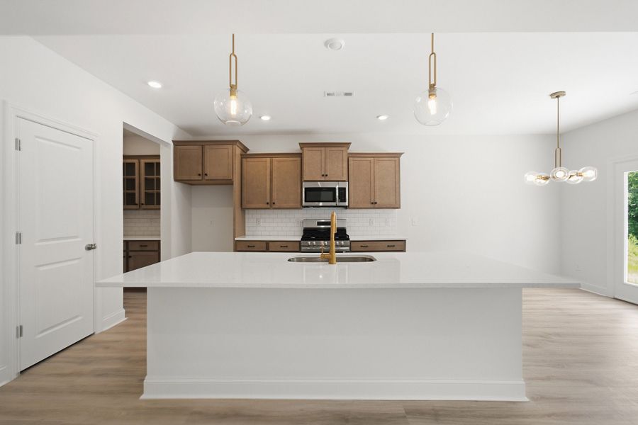 Furnished interior view inside a new home in Aden Woods, Fairview (Image 8).
