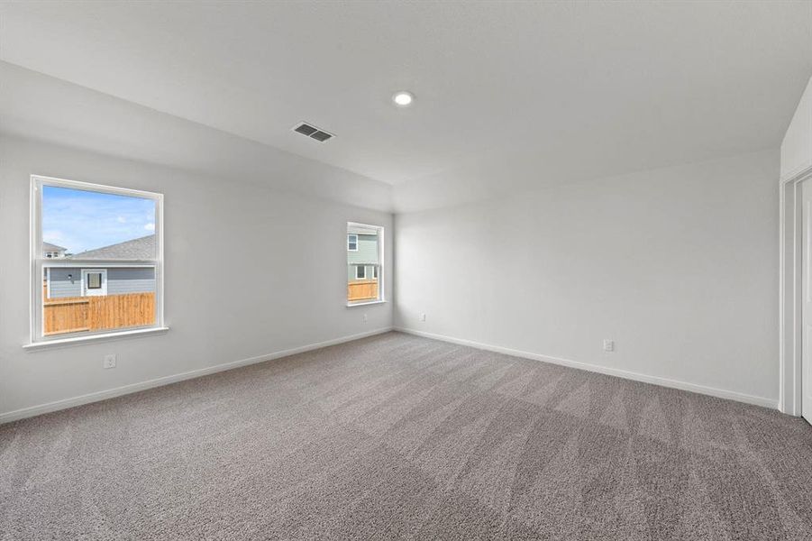 Spare room featuring carpet flooring and recessed lighting