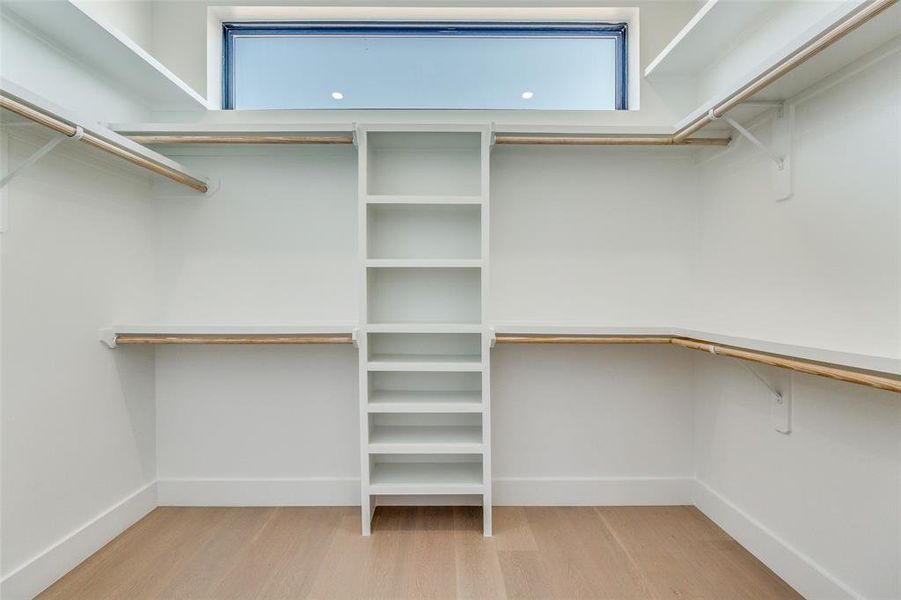 Walk in closet featuring light wood finished floors