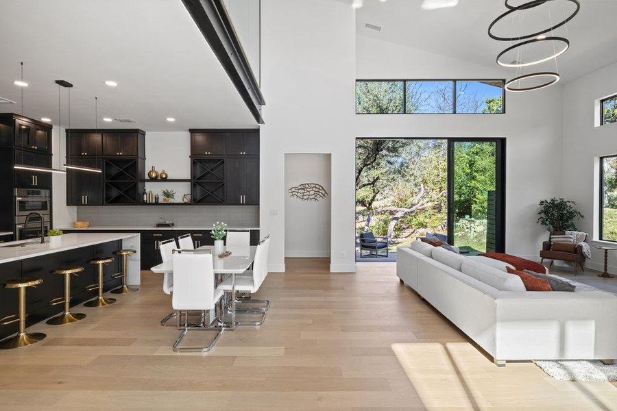 Oversized glass sliders open the great room onto the back deck, seamlessly connecting your indoor and outdoor living spaces.