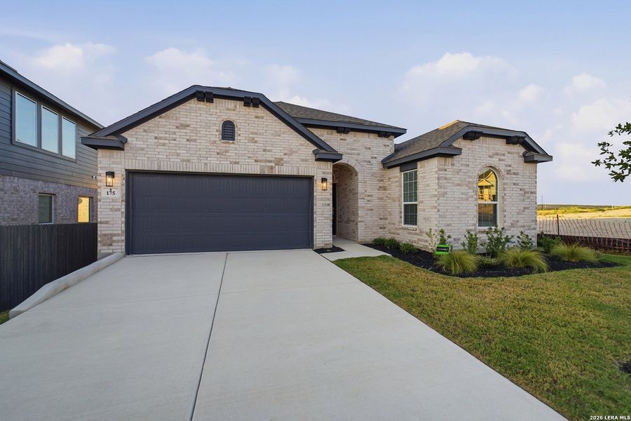 Front exterior of a new home in The Woodlands at Medina Hills, Mico, TX, highlighting curb appeal (Image 21).