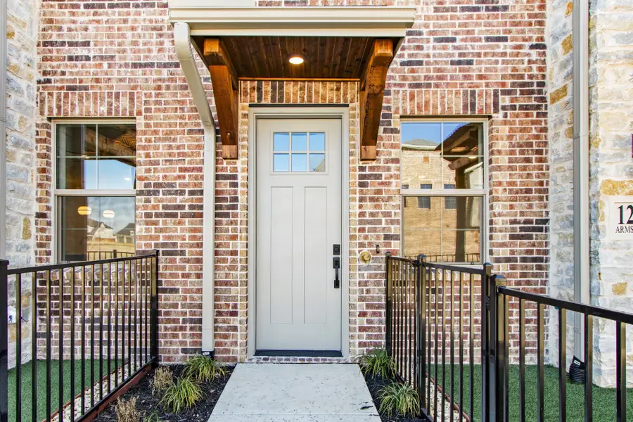 Exterior details and patio area of a home in The Tribute, The Colony (Image 3).