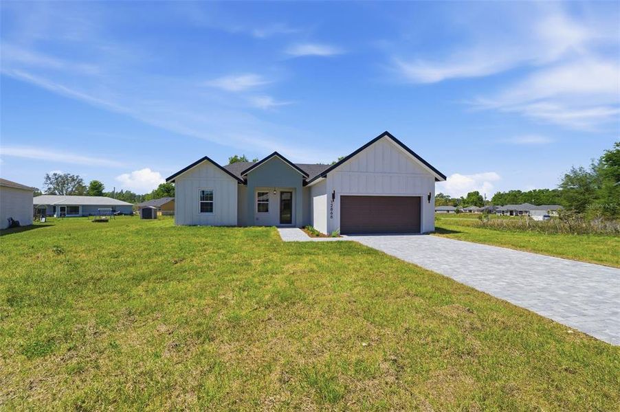 Front exterior of a new home in , Ocala, FL, highlighting curb appeal (Image 20).