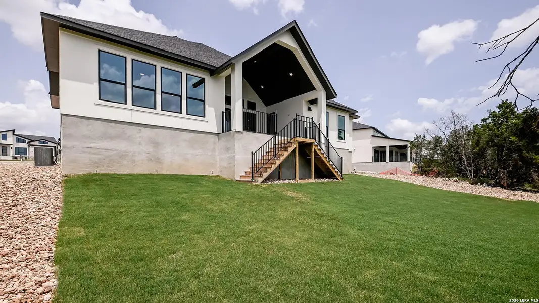 Exterior details and patio area of a home in The Preserve at Elm Creek, New Braunfels (Image 23).
