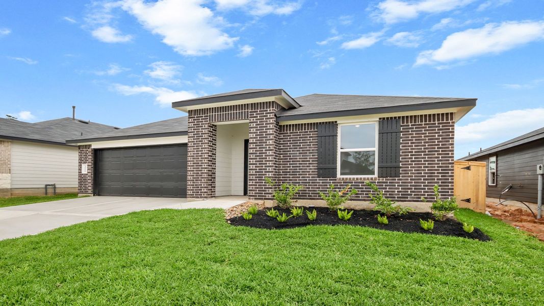 Front exterior of a new home in Mill Creek, Magnolia, TX, highlighting curb appeal (Image 18). Front exterior of a new home in Mill Creek, Magnolia, TX, highlighting curb appeal (Image 18).