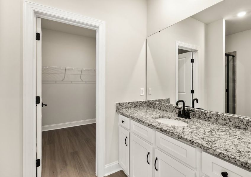 This bathroom has a glass-enclosed shower.