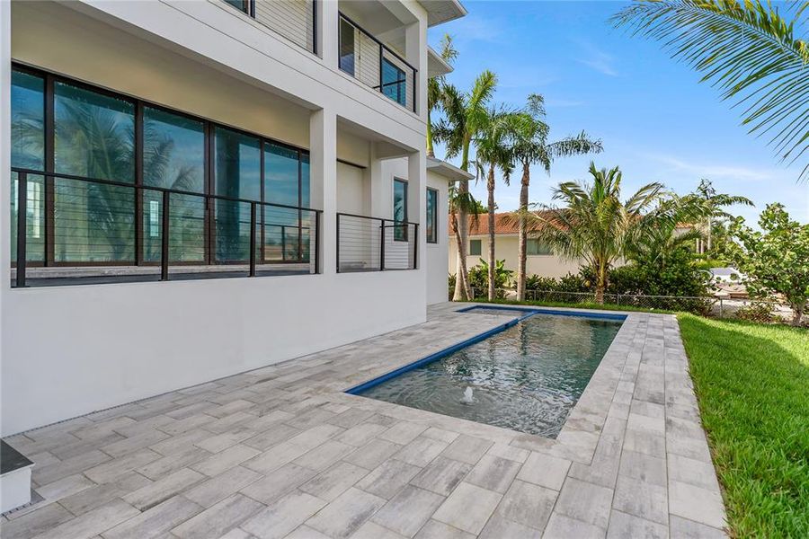 Front exterior of a new home in , Longboat Key, FL, highlighting curb appeal (Image 35). Front exterior of a new home in , Longboat Key, FL, highlighting curb appeal (Image 35).