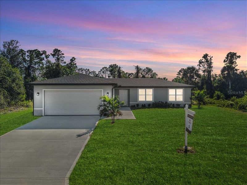Front exterior of a new home in , North Port, FL, highlighting curb appeal (Image 1). Front exterior of a new home in , North Port, FL, highlighting curb appeal (Image 1).