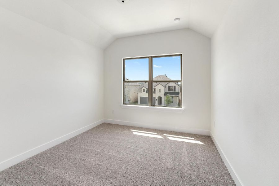 Bonus room with carpet flooring, baseboards, and vaulted ceiling Bonus room with carpet flooring, baseboards, and vaulted ceiling