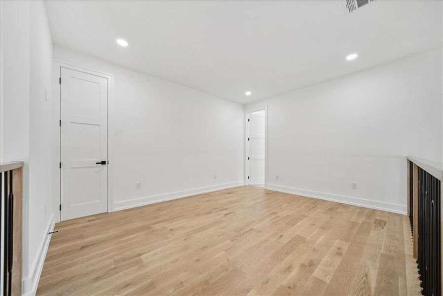 Unfurnished living room with light hardwood floors