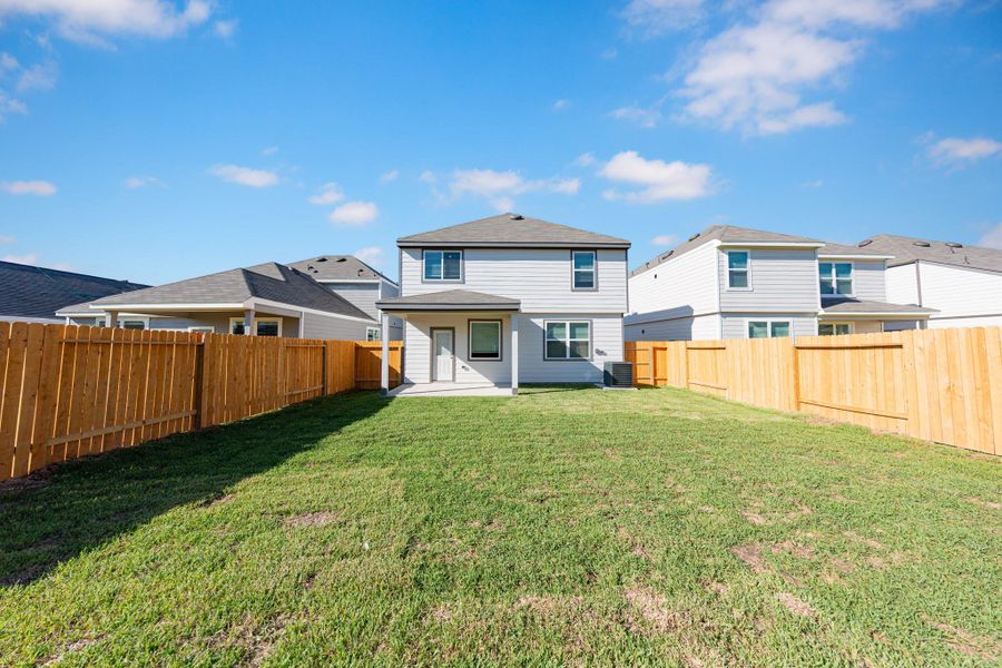 Front exterior of a new home in Wayside Village, Houston, TX, highlighting curb appeal (Image 12). Front exterior of a new home in Wayside Village, Houston, TX, highlighting curb appeal (Image 12).