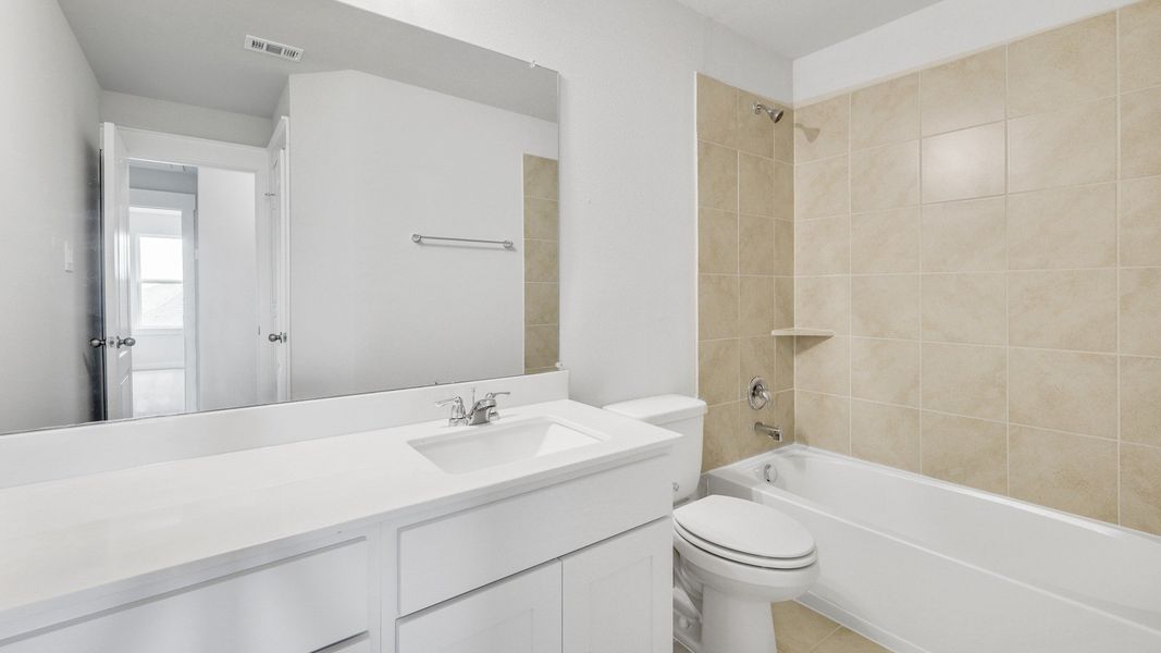 Representative furnished interior of a home built from the Meyerson by Brightland Homes in Sunterra, Katy (Image 14).