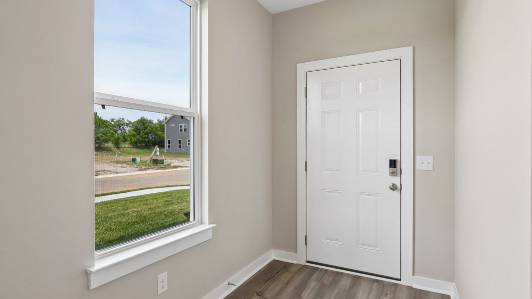 Front Door to home with nearby window