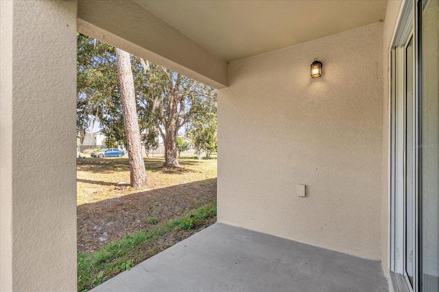 Exterior details and patio area of a home in Poinciana Village, Kissimmee (Image 17).