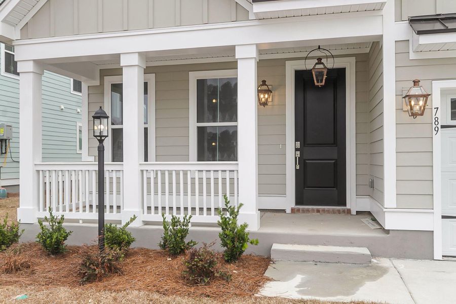 Exterior details and patio area of a home in Tidewater at Lakes of Cane Bay, Summerville (Image 3).