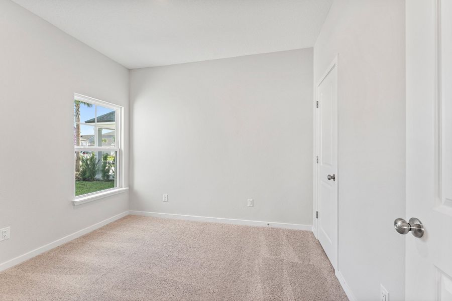Lot 19 Cedar II Guest Room with Window Overlooking Front Yard at Camden Woods in Kingsland, GA