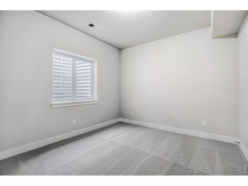 Spacious, unfurnished interior of a new home in RainDance, Windsor (Image 27).