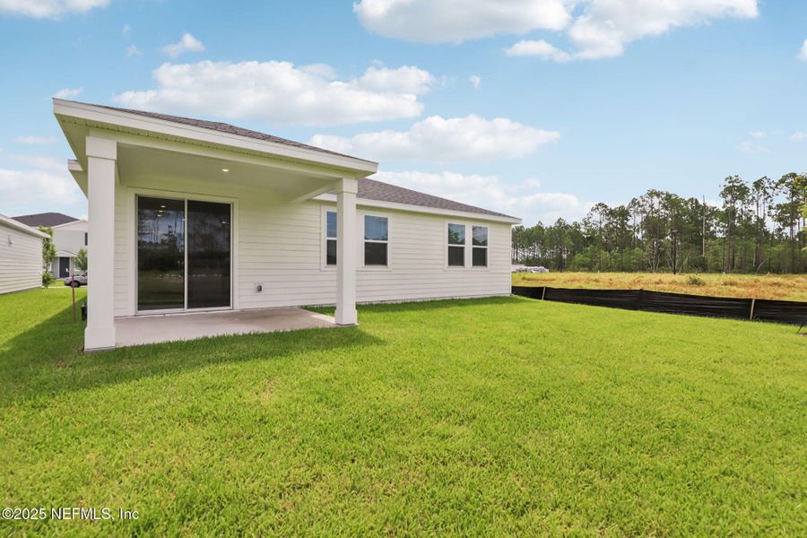 Front exterior of a new home in , Palm Coast, FL, highlighting curb appeal (Image 26).