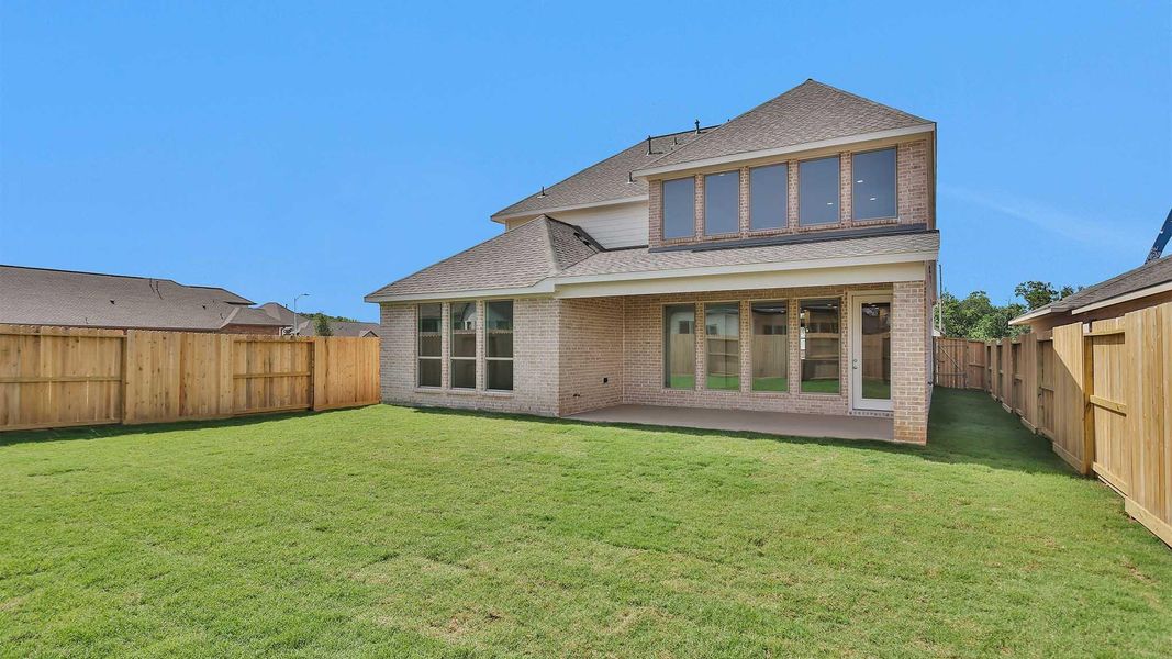 Front exterior of a new home in Candela South 50', Richmond, TX, highlighting curb appeal (Image 12). Front exterior of a new home in Candela South 50', Richmond, TX, highlighting curb appeal (Image 12).