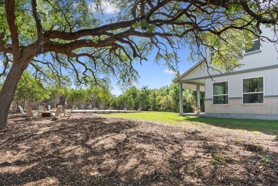 View of green lawn with a patio