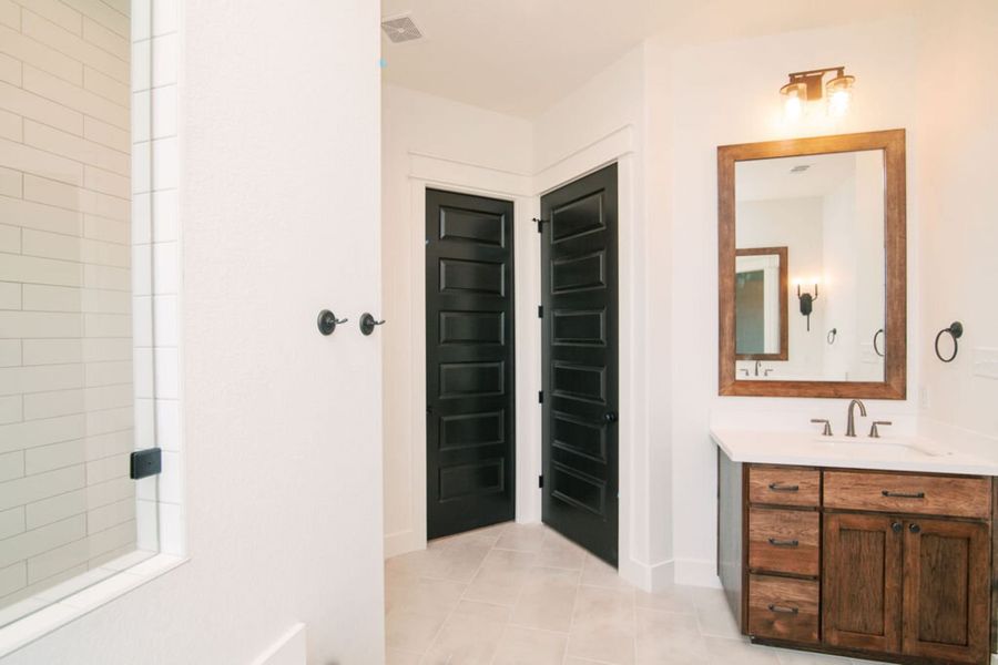 Representative furnished interior of a home built from the The Julia by Reece Homes in Pebble Creek, College Station (Image 47).