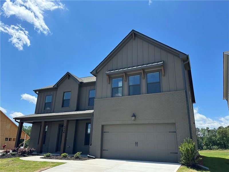 Front exterior of a new home in Summerlin, Winder, GA, highlighting curb appeal (Image 37). Front exterior of a new home in Summerlin, Winder, GA, highlighting curb appeal (Image 37).