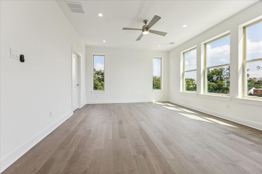 Primary Bedroom * On the Third Floor * Hardwood Floors * Abundance of Windows for Natural Light. Primary Bedroom * On the Third Floor * Hardwood Floors * Abundance of Windows for Natural Light.