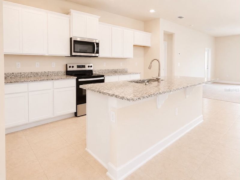 Furnished interior view inside a new home in Harmony Central, St. Cloud (Image 5).