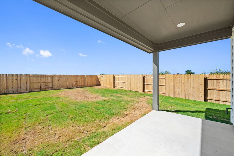 Exterior details and patio area of a home in Terrace Collection At Turner's Crossing, Buda (Image 29).