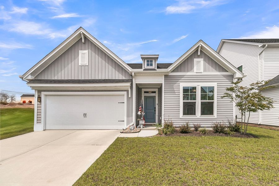 Front exterior of a new home in The Groves of Berkeley, Moncks Corner, SC, highlighting curb appeal (Image 25).