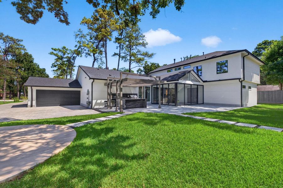 Generous backyard provides abundant lawn space surrounded by mature landscaping.