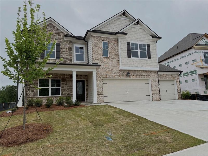 Front exterior of a new home in Ponderosa Farms Manor, Gainesville, GA, highlighting curb appeal (Image 28).