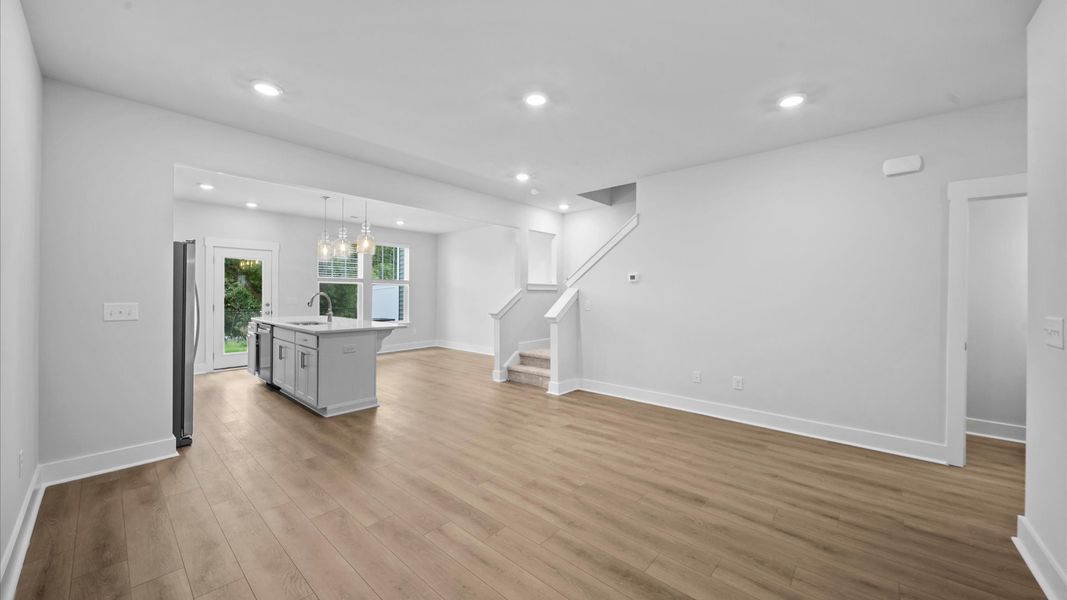 Exceptional family space with hardwood floors and seamless flow to dining & kitchen areas at Saluda Crossing in Piedmont, SC