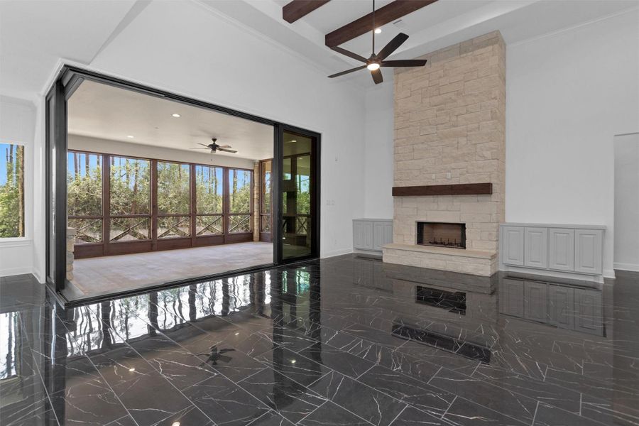 Sliding glass door opens to a spacious screened-in patio, blending indoor luxury with the tranquility of forested surroundings. Sliding glass door opens to a spacious screened-in patio, blending indoor luxury with the tranquility of forested surroundings.