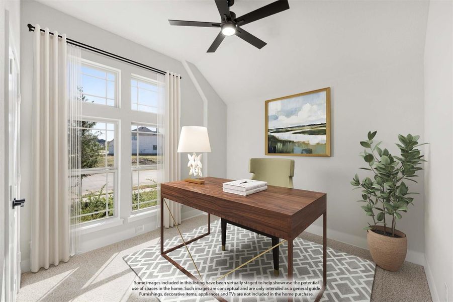 Home office with vaulted ceiling, wood desk, ceiling fan, and large windows with natural light