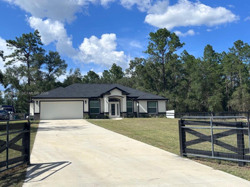 Front exterior of a new home in , Dunnellon, FL, highlighting curb appeal (Image 14).