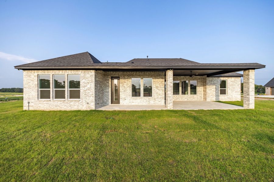 Front exterior of a new home in Prairie Winds Estates, Poolville, TX, highlighting curb appeal (Image 6). Front exterior of a new home in Prairie Winds Estates, Poolville, TX, highlighting curb appeal (Image 6).