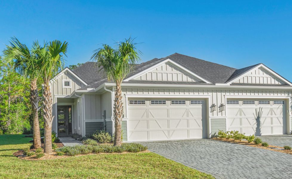 Front exterior of a new home in Woodhaven, Port Orange, FL, highlighting curb appeal (Image 1). Front exterior of a new home in Woodhaven, Port Orange, FL, highlighting curb appeal (Image 1).