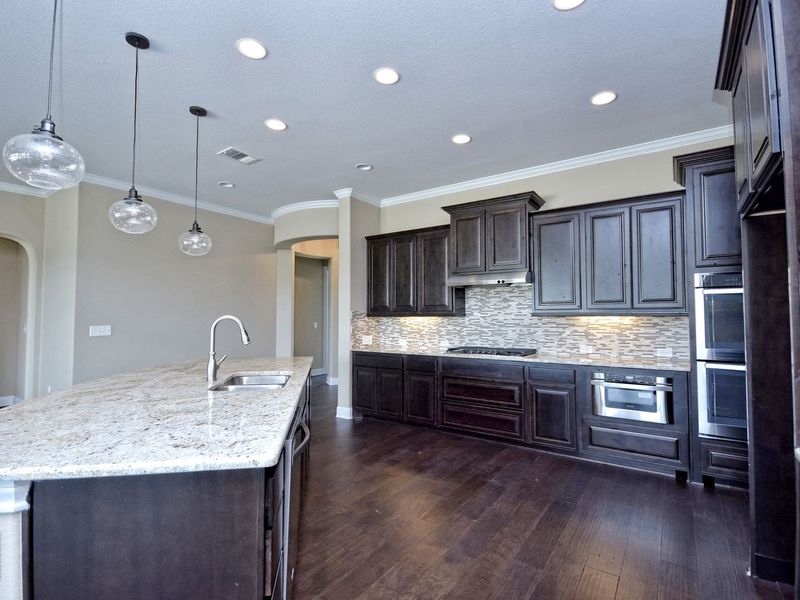 Representative furnished interior of a home built from the Madera II by Giddens Homes in Scofield Farms Estates, Georgetown (Image 223).