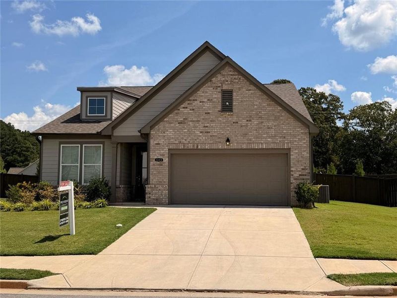 Front exterior of a new home in Wehunt Meadows, Hoschton, GA, highlighting curb appeal (Image 22).