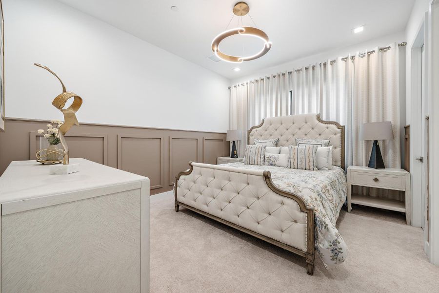 Designer lighting, decorative wall moldings, and curtains.