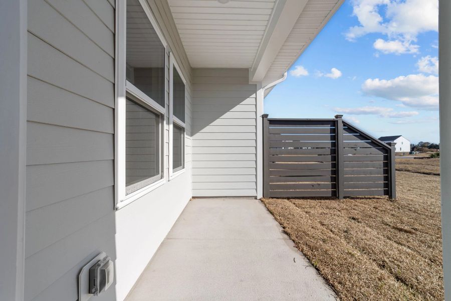 Exterior details and patio area of a home in Blue Heron Retreat, Little River (Image 4).