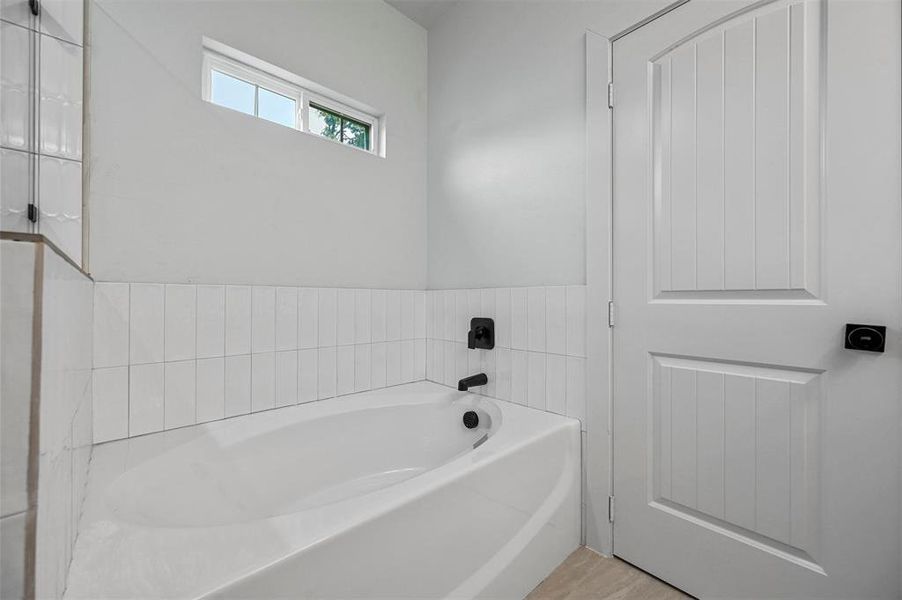 Primary bathroom with a bathtub