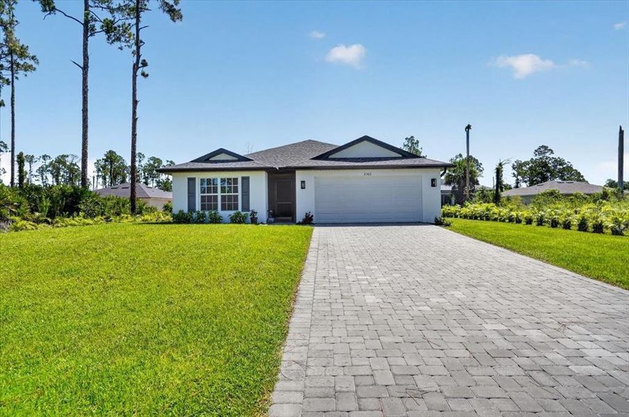 Front exterior of a new home in , North Port, FL, highlighting curb appeal (Image 23). Front exterior of a new home in , North Port, FL, highlighting curb appeal (Image 23).