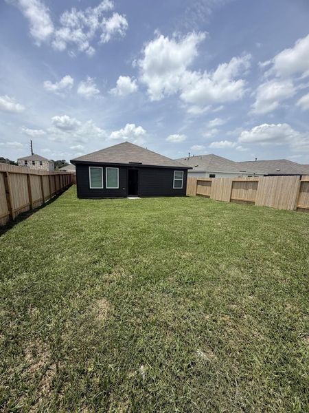Exterior details and patio area of a home in Sweetgrass Village, Crosby (Image 4).